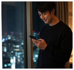 Man reading a message at night